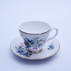 Liverpool Road Pottery Tasse und Untertasse aus Knochenporzellan, blau geblümt, Gold Nassau, England